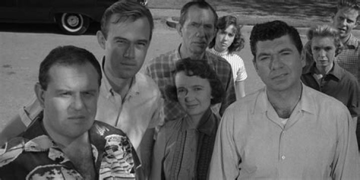 At the beginning of the teleplay what is the mood on maple street?