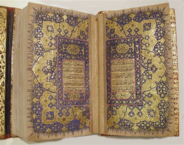 When was the quran written and who wrote it?