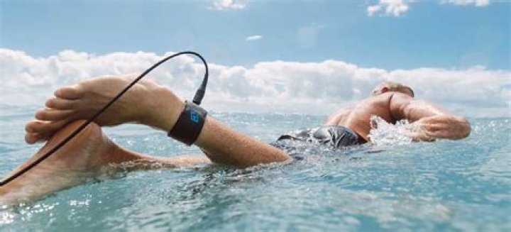 When were surfboard leashes invented?