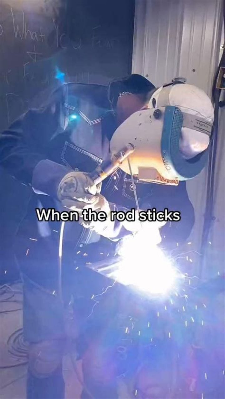 Why welding rod sticks to metal?