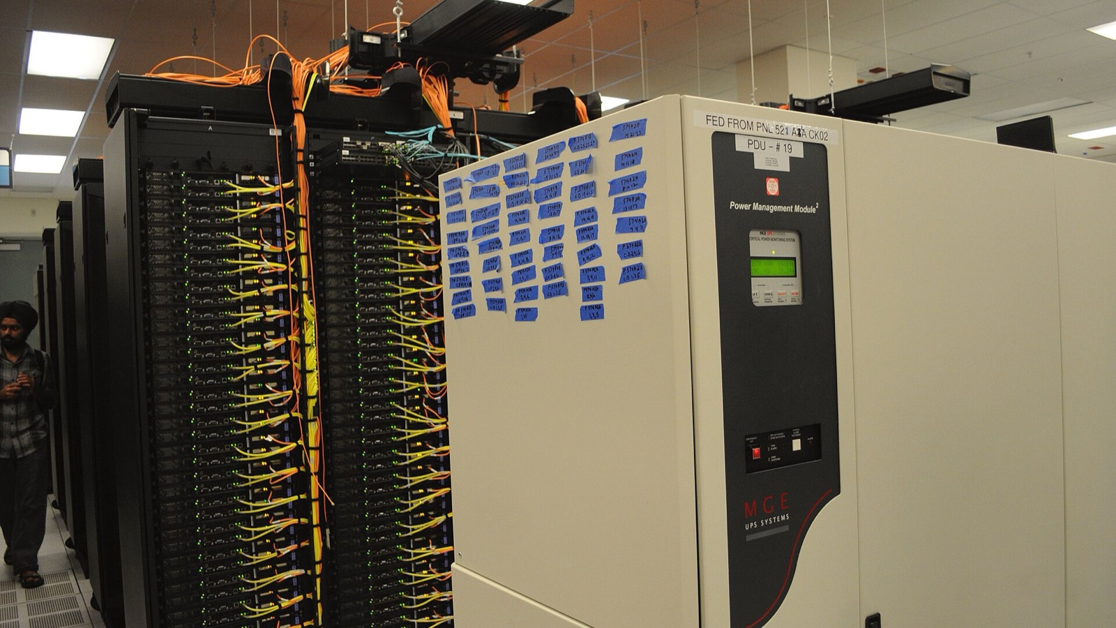 Server racks and a power management cabinet at the NERSC data centre.