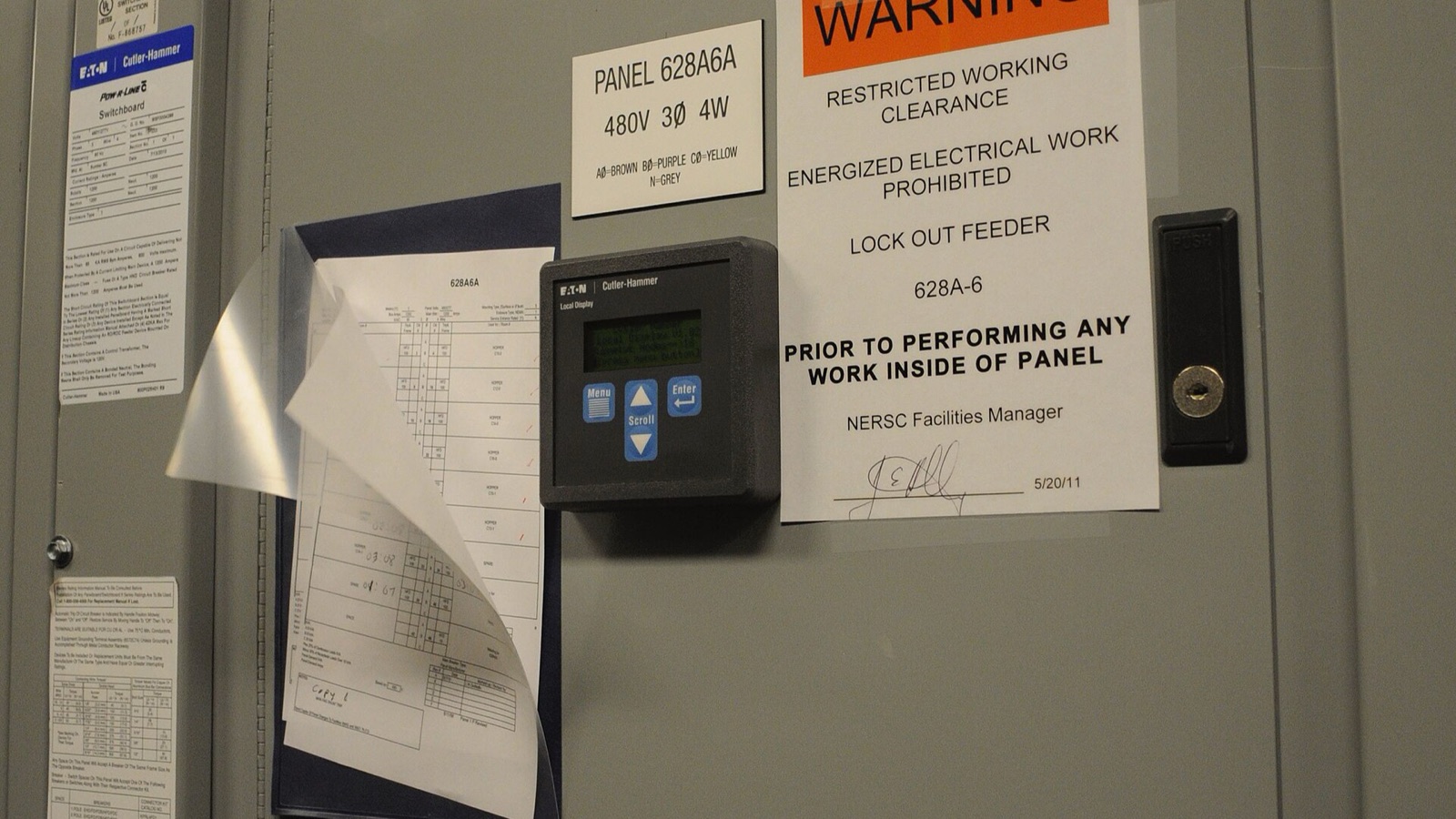 Electrical distribution panels and a power meter at the NERSC data centre.